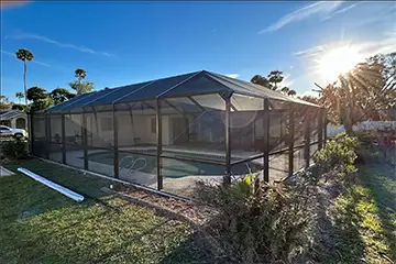 Bronze mansard style pool enclosure by East Coast Aluminum